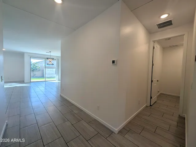 a house view with swimming pool in front of it