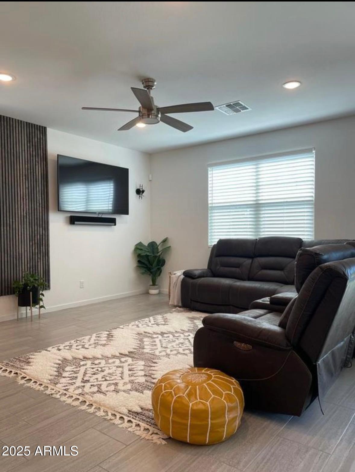 22547 East Quintero Road Queen Creek, AZ 85142 - Photo 8 of 17 a living room with furniture and a flat screen tv