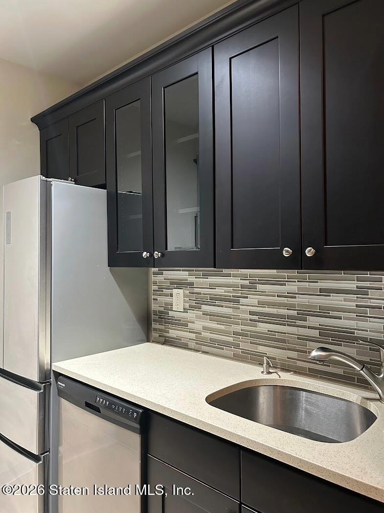 1235 Forest Hill Road, Unit 1G Staten Island, NY 10314 - Photo 6 of 11 a kitchen with a sink and a refrigerator