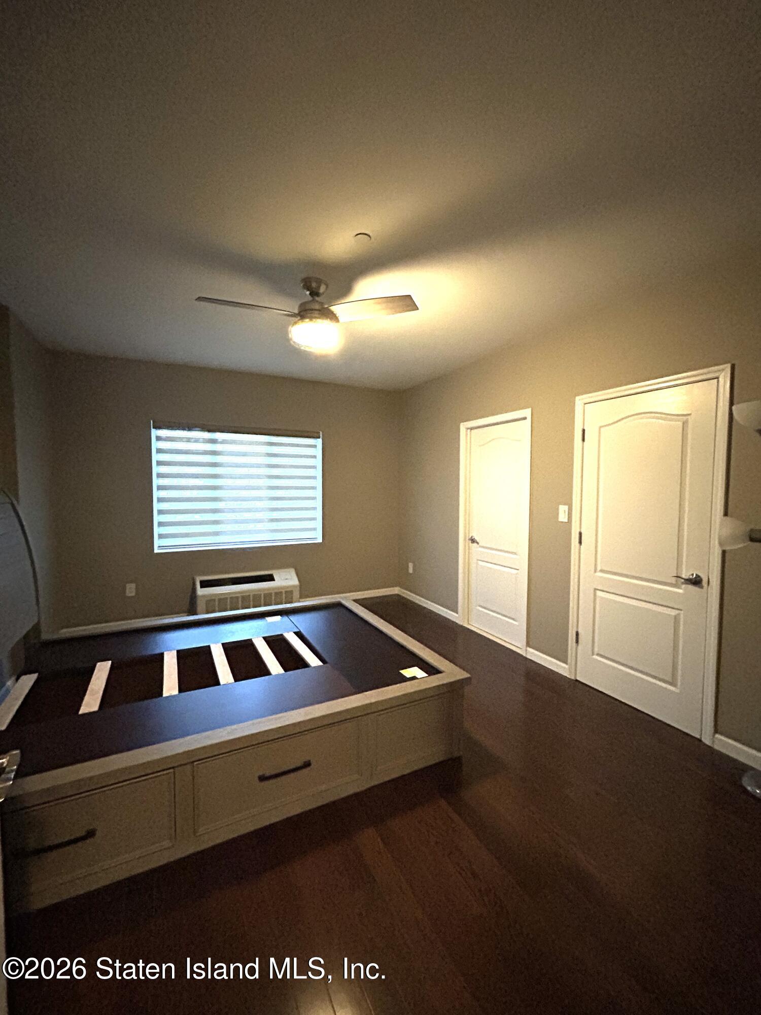1235 Forest Hill Road, Unit 1G Staten Island, NY 10314 - Photo 10 of 11 a room with pool table and windows