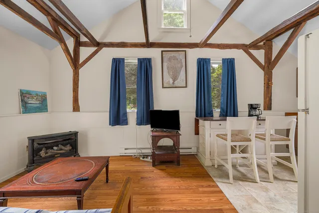 a kitchen with stainless steel appliances a stove a refrigerator and a microwave