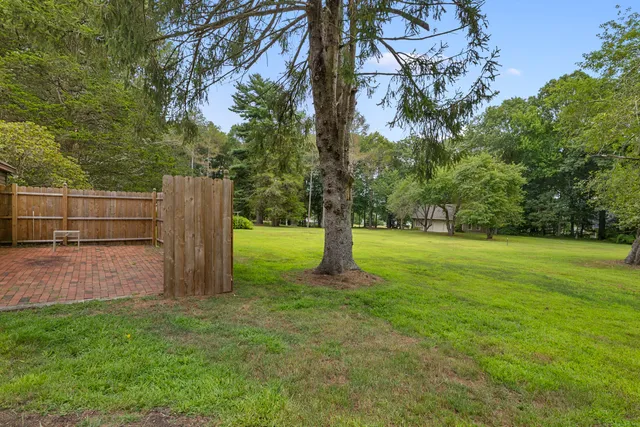 a view of a lake with houses in the back
