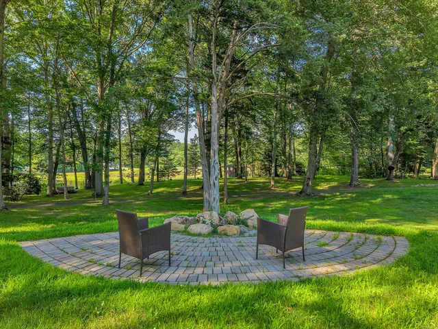 a view of a park with sitting area