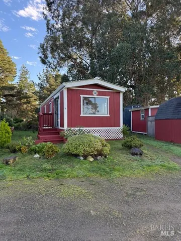 a kitchen with stainless steel appliances granite countertop a refrigerator a stove and a sink