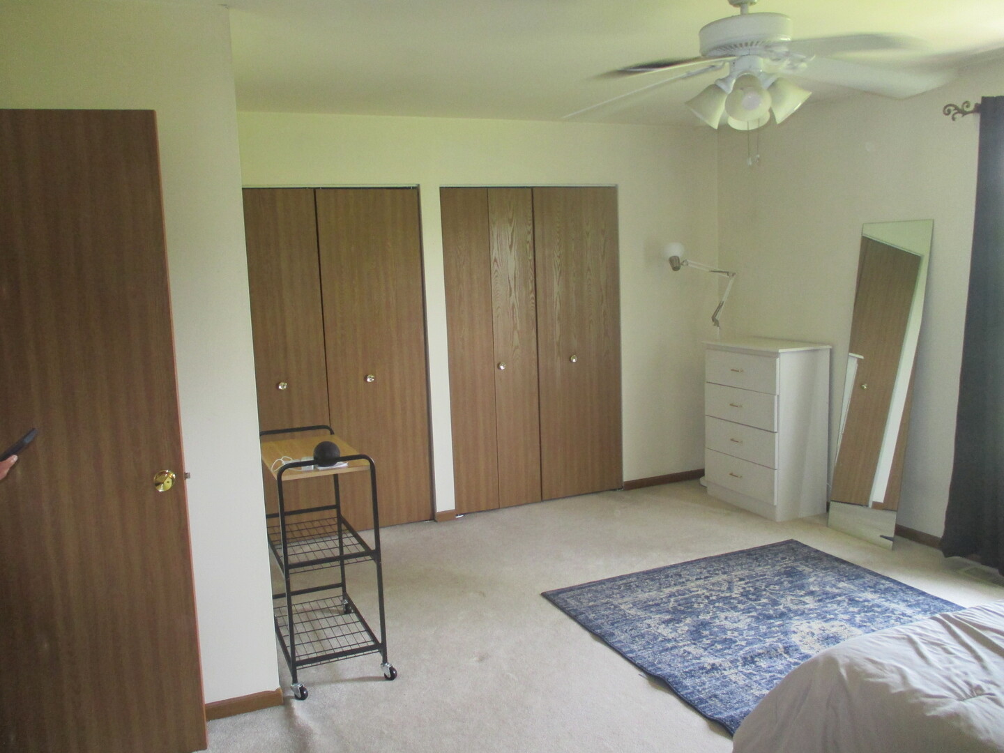 865 Tamarac Boulevard Addison, IL 60101 - Photo 13 of 21 a view of a bedroom with wooden floor and cabinet