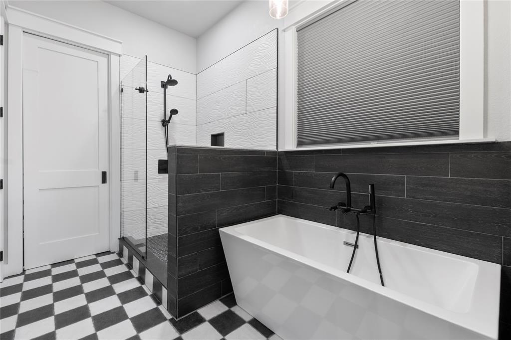 807 Midway Road Tool, TX 75143 - Photo 13 of 39 a bathroom with a bathtub and a shower