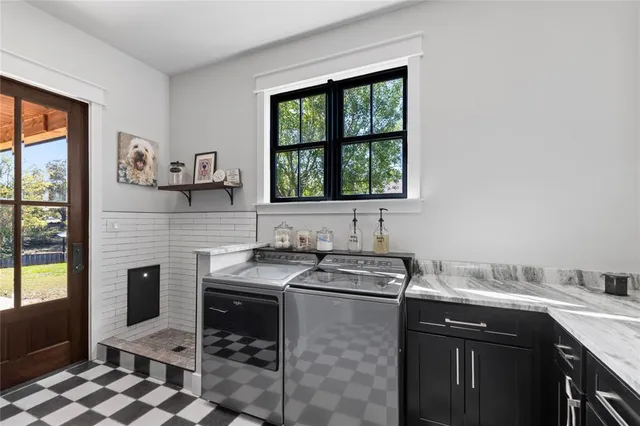a kitchen with sink cabinets and window