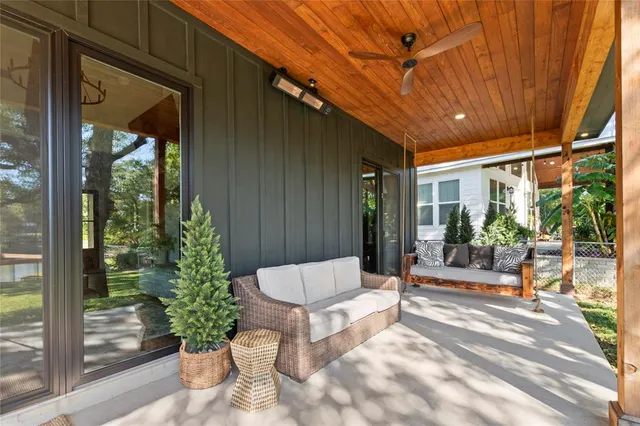 a building outdoor space with porch and furniture