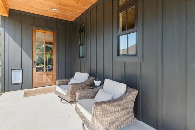 swimming pool view with a seating space