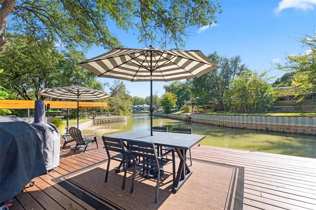 a view of yard with swimming pool and sitting area