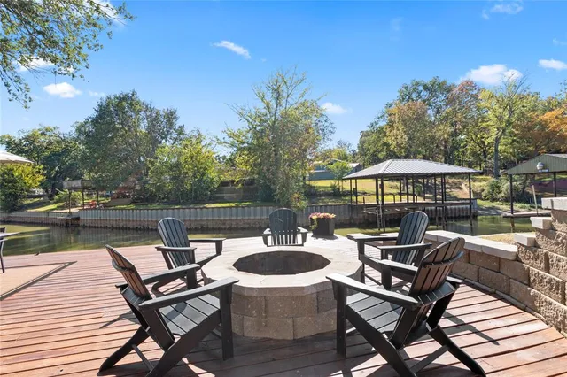 a small pool with table and chairs