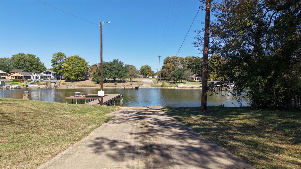807 Midway Road Tool, TX 75143 - Photo 38 of 39 a view of a lake with houses next to road