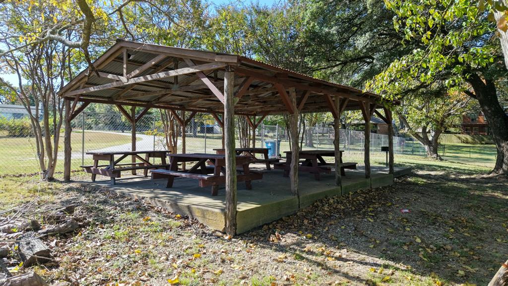 807 Midway Road Tool, TX 75143 - Photo 39 of 39 a view of a backyard with a table and chairs under an umbrella