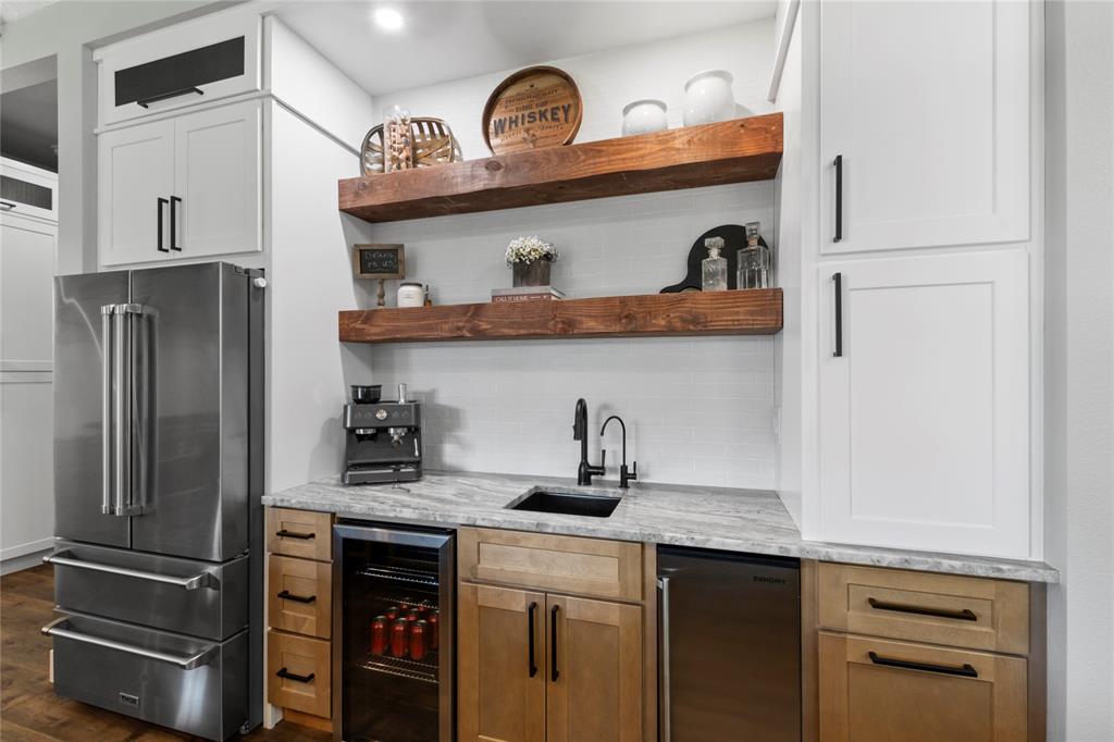807 Midway Road Tool, TX 75143 - Photo 5 of 39 a kitchen with stainless steel appliances granite countertop a refrigerator and a stove