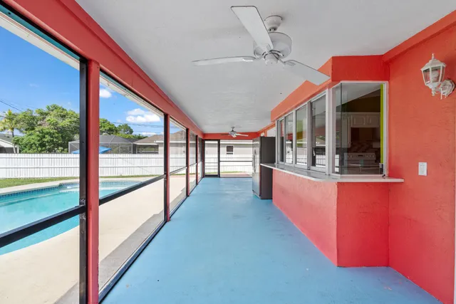 a view of a kitchen and an empty room
