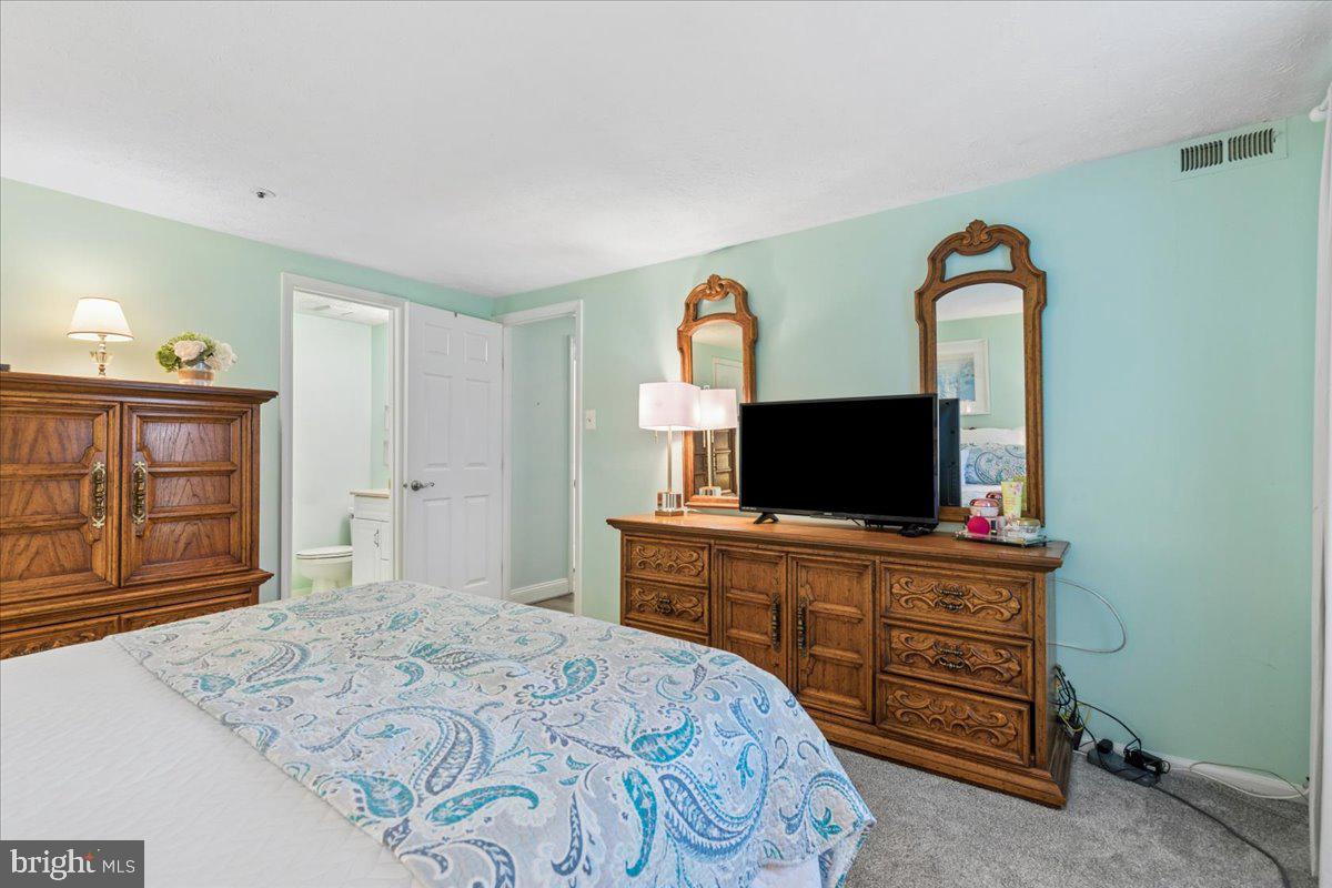 625 Deering Road, Unit 2A Pasadena, MD 21122 - Photo 18 of 32 Ensuite primary bedroom with full bath