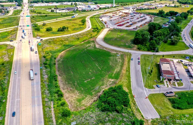 an aerial view of residential house with outdoor space and swimming pool