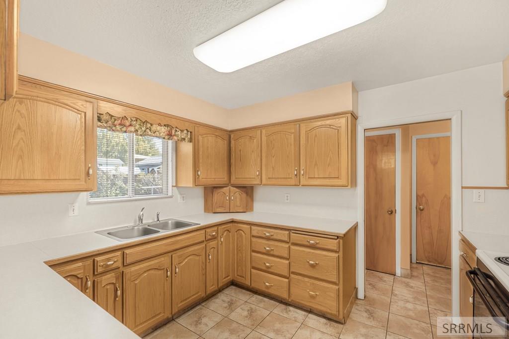 159 Birch Avenue Rexburg, ID 83440 - Photo 11 of 31 Kitchen with East facing window to backyard