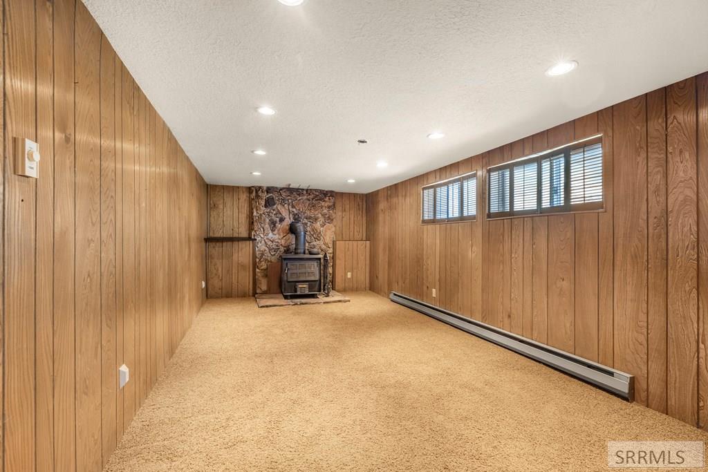 159 Birch Avenue Rexburg, ID 83440 - Photo 18 of 31 Lower Family Room with wood-burner fireplace