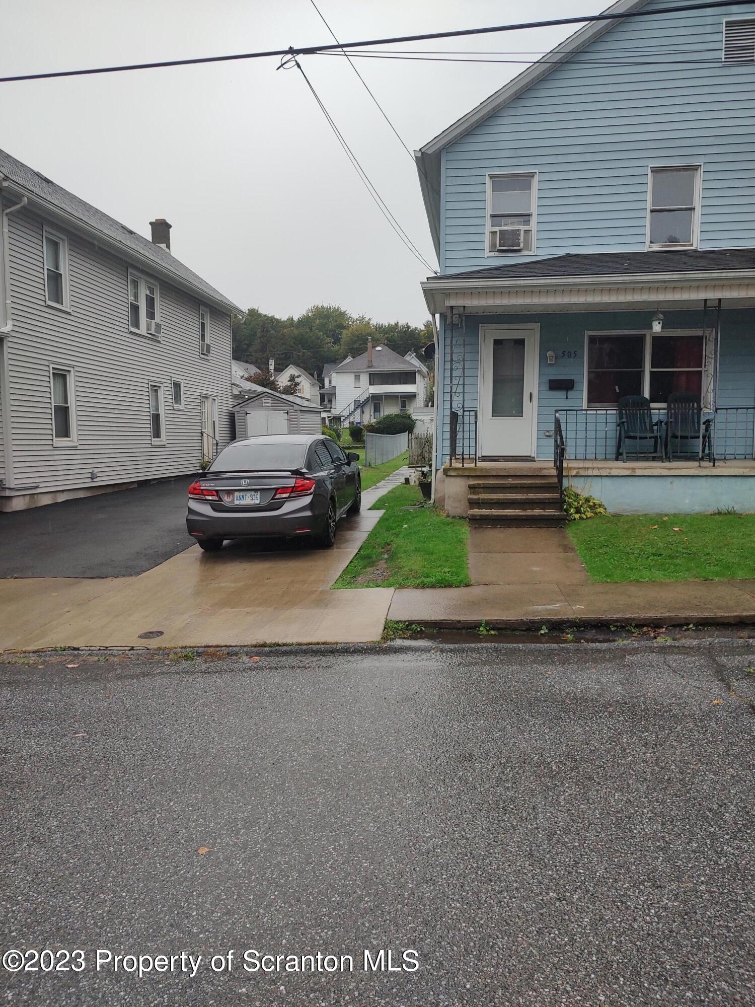 505 Cayuga Street Scranton, PA 18508 - Photo 1 of 13 a front view of a house with garden