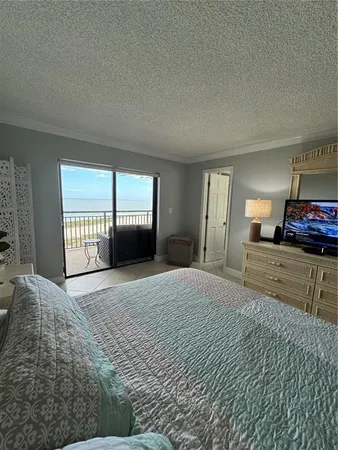 a living room with a couch and a stove top oven