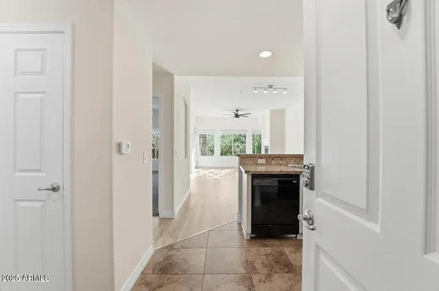 a room with a stove and cabinets