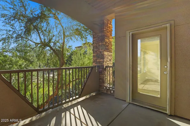 a view of balcony with wooden floor