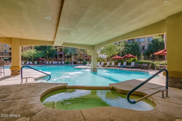 a view of a swimming pool with a patio
