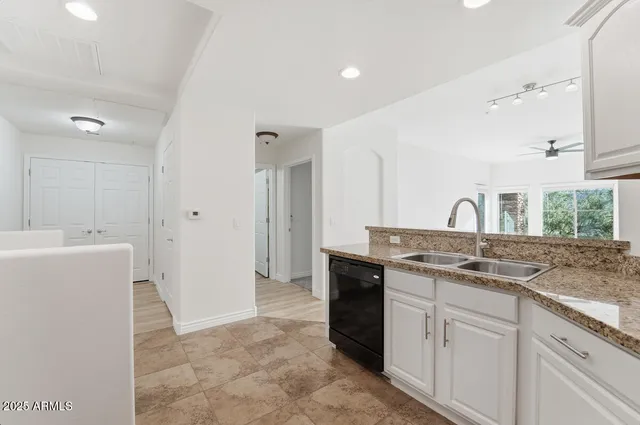 a kitchen with a sink and a refrigerator