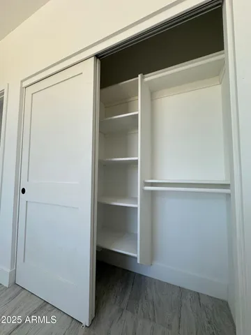 a view of an empty walk in closet