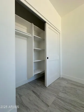 a view of an empty walk in closet