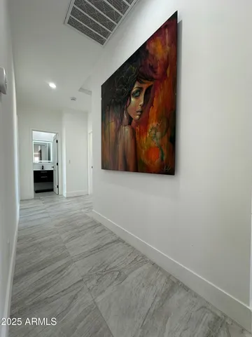 a view of room with wooden floor and wall