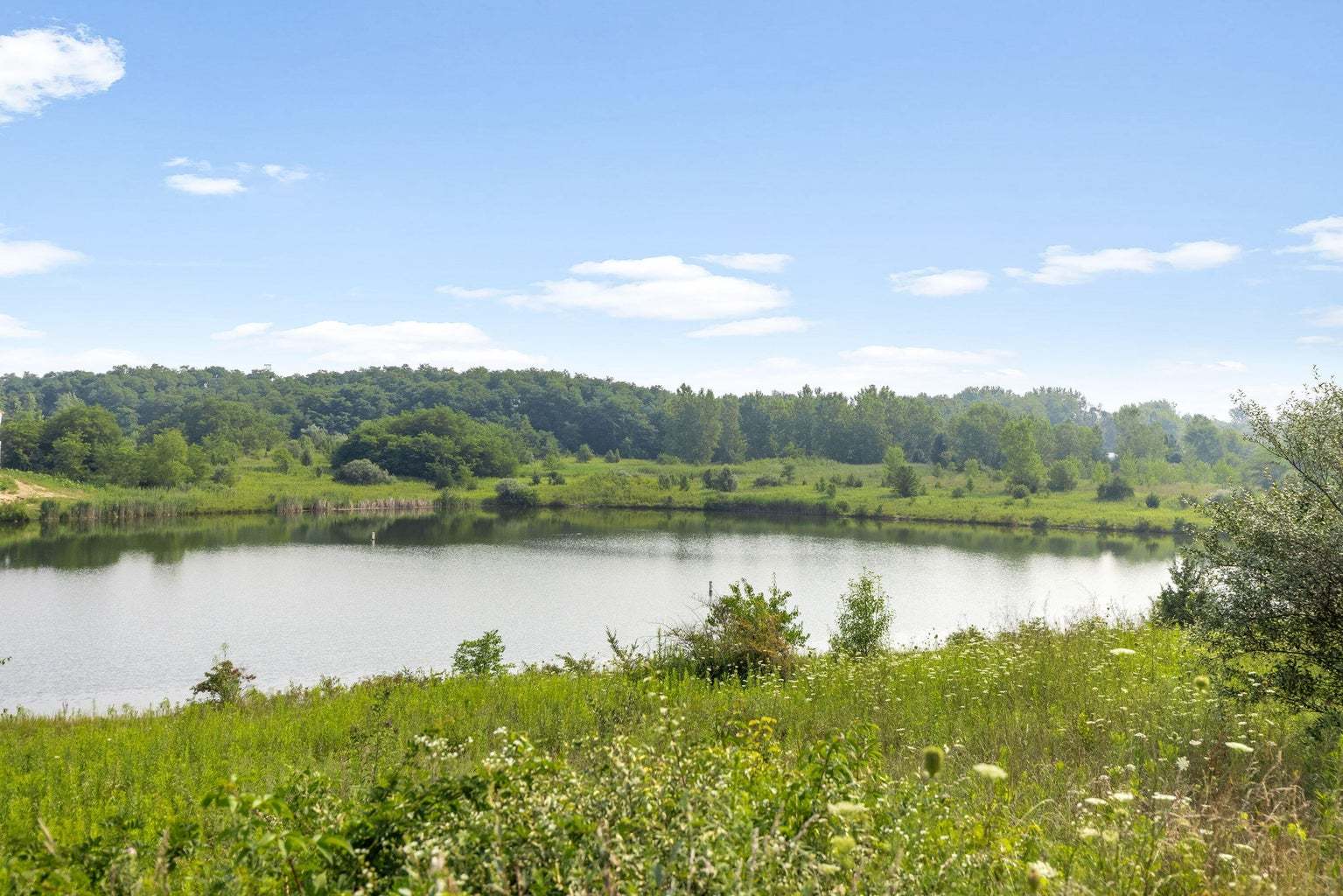 9315 Doubletree Drive South Winfield, IN 46307 - Photo 22 of 28 a view of a lake with a mountain in the background