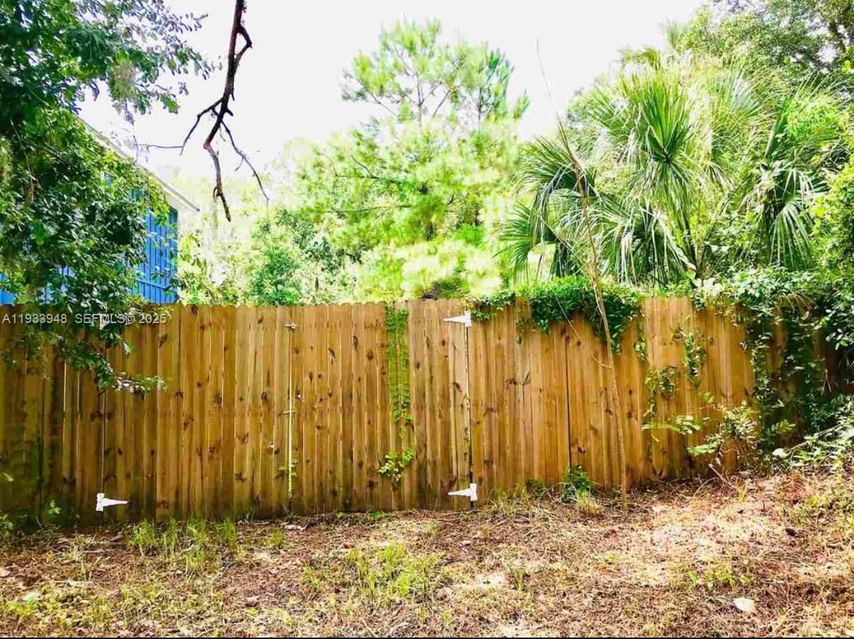 901 Cooper Street St. Augustine, FL 32084 - Photo 2 of 6 a view of wooden fence