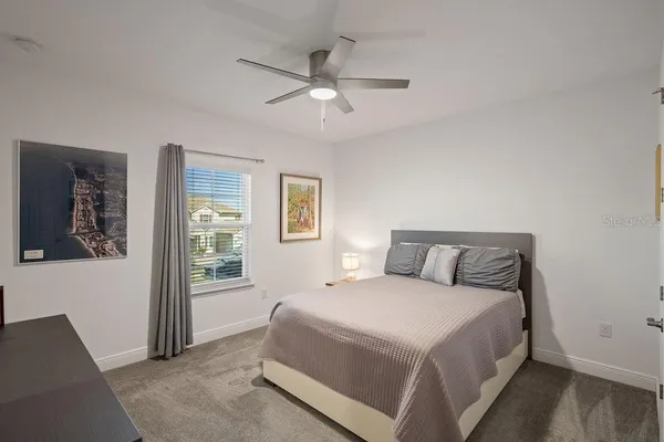 a view of a patio with a table and chairs