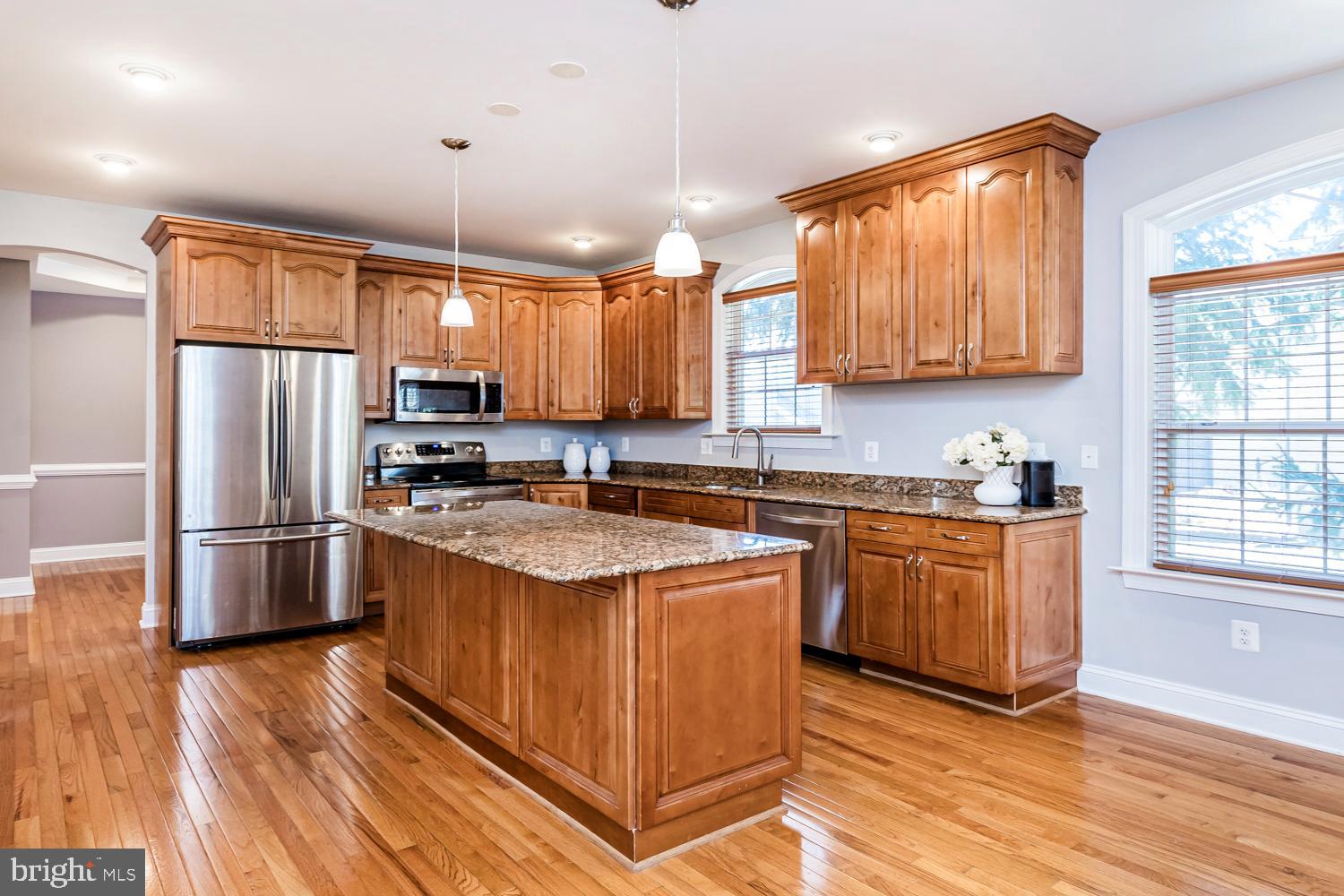 5642 Waterloo Road Columbia, MD 21045 - Photo 18 of 67 Warm wood tones in a spacious kitchen.