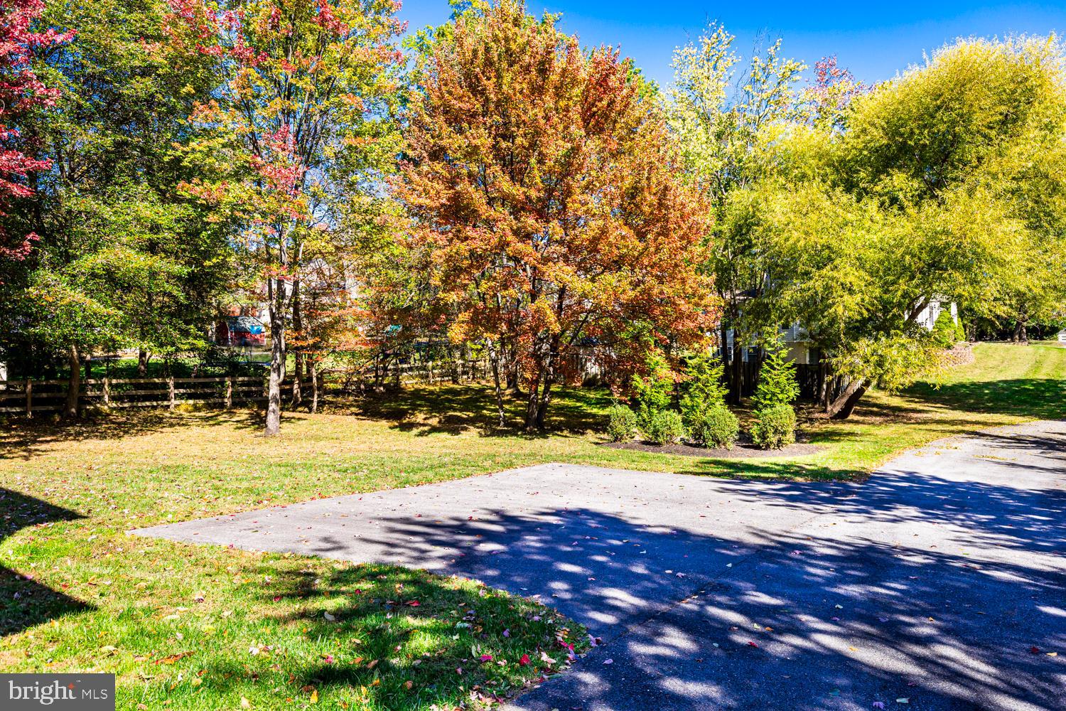 5642 Waterloo Road Columbia, MD 21045 - Photo 3 of 67 Vibrant autumn hues in a serene landscape.
