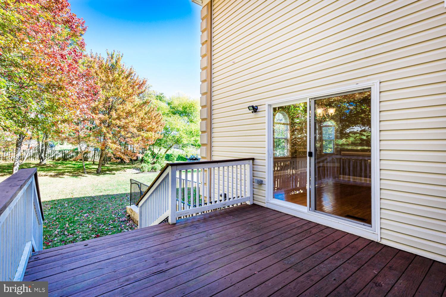 5642 Waterloo Road Columbia, MD 21045 - Photo 34 of 67 Serene deck with vibrant autumn backdrop.
