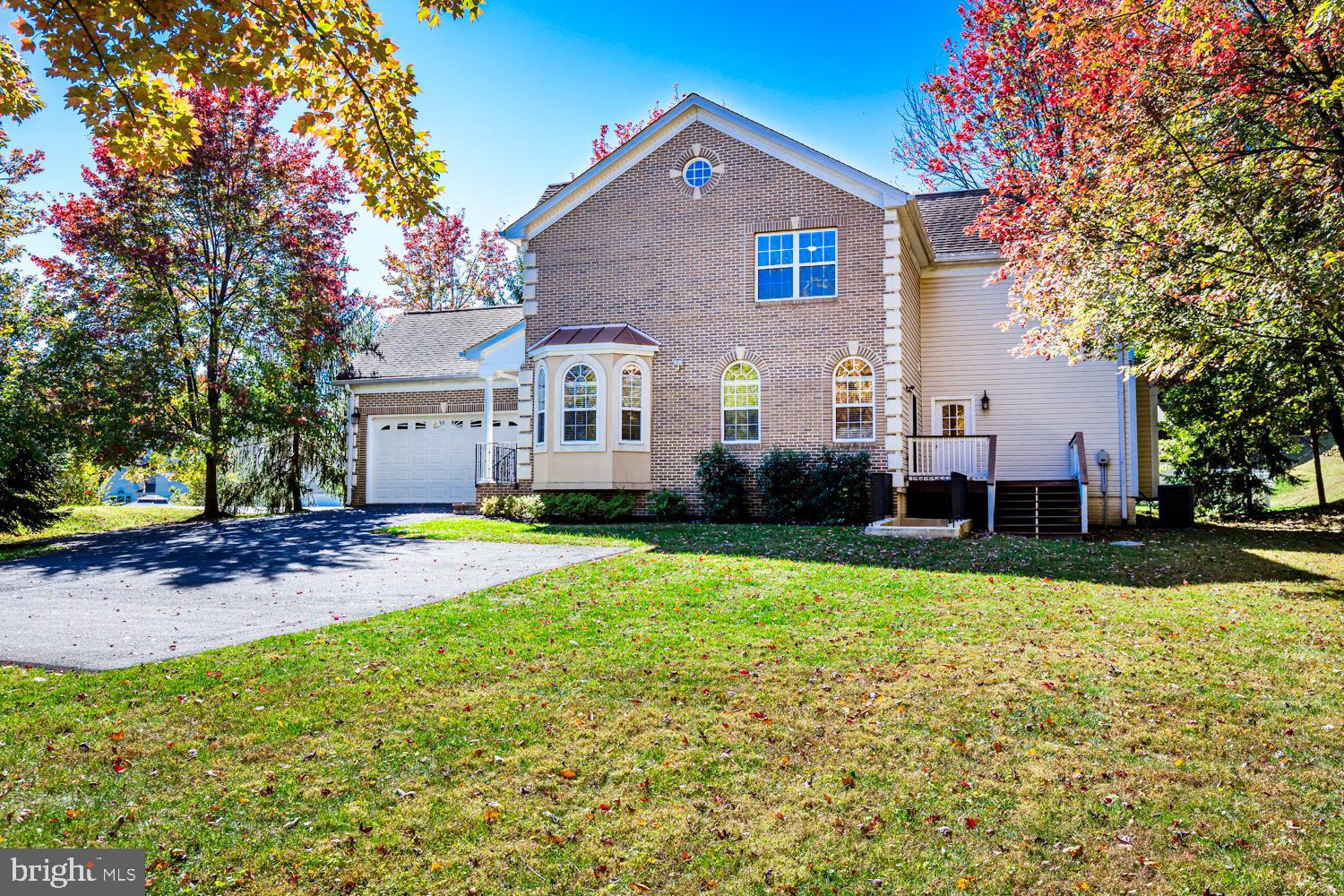 5642 Waterloo Road Columbia, MD 21045 - Photo 4 of 67 Charming home with vibrant autumn backdrop.