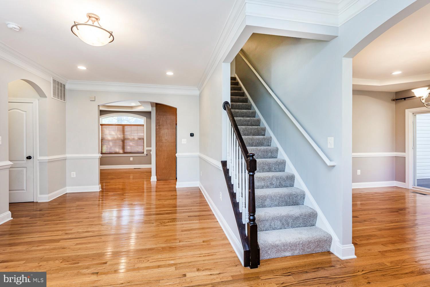5642 Waterloo Road Columbia, MD 21045 - Photo 8 of 67 Inviting entryway with elegant staircase.