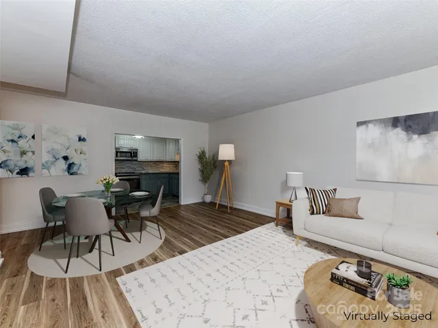 a bedroom with furniture and a wooden floor