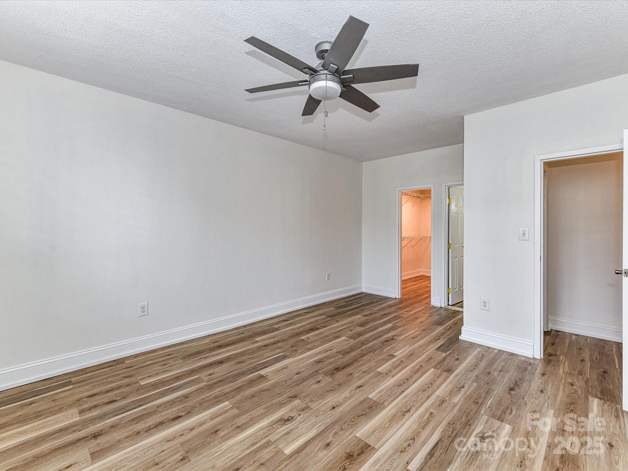 1300 Reece Road, Unit 111 Charlotte, NC 28209 - Photo 12 of 29 wooden floor in an empty room