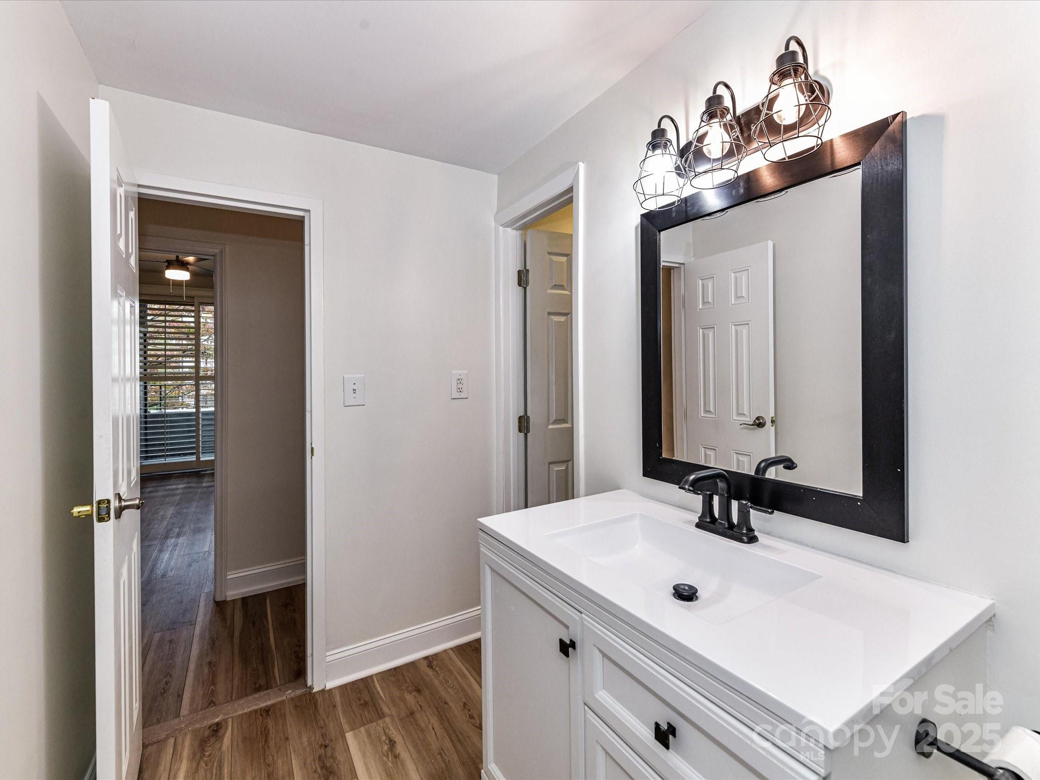 1300 Reece Road, Unit 111 Charlotte, NC 28209 - Photo 19 of 29 a bathroom with a sink and a mirror