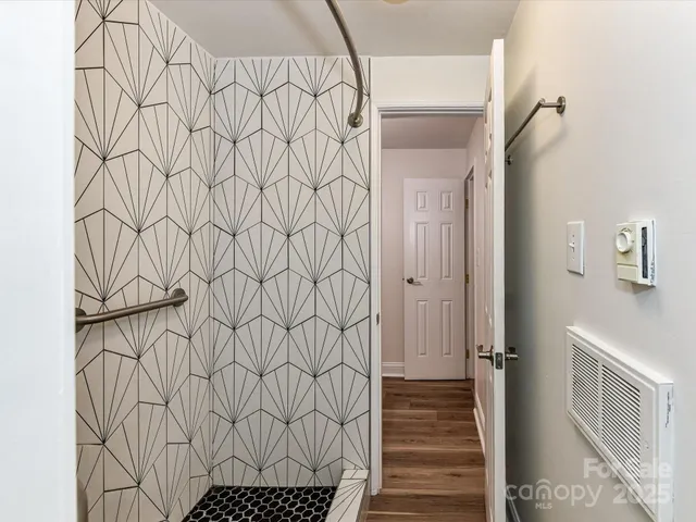 a bathroom with a bathtub and shower curtain