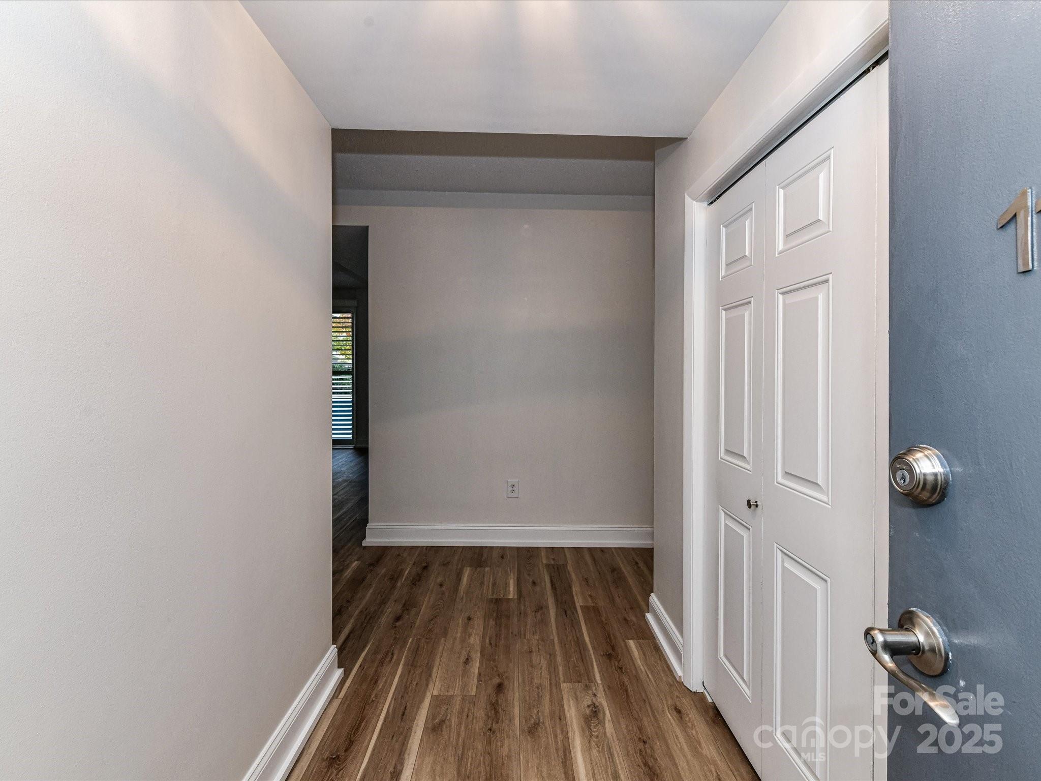 1300 Reece Road, Unit 111 Charlotte, NC 28209 - Photo 6 of 29 a view of a room with wooden floor