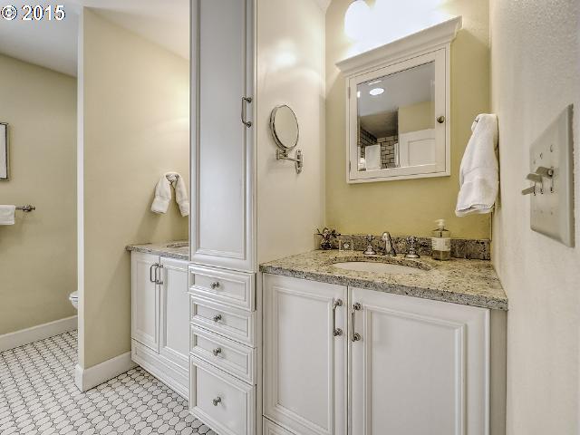 7524 Southwest View Point Terrace Portland, OR 97219 - Photo 11 of 16 a bathroom with cabinets granite and a sink
