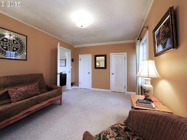 7524 Southwest View Point Terrace Portland, OR 97219 - Photo 16 of 16 a bedroom with furniture and a window