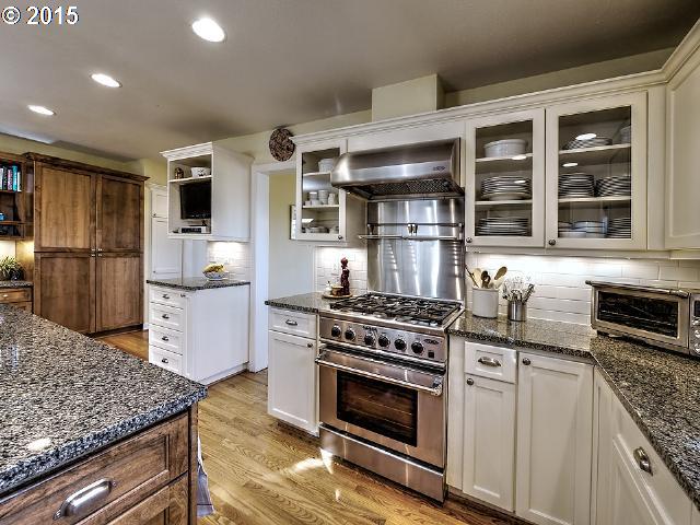 7524 Southwest View Point Terrace Portland, OR 97219 - Photo 8 of 16 a kitchen with granite countertop a stove and a sink
