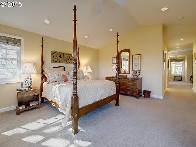 7524 Southwest View Point Terrace Portland, OR 97219 - Photo 10 of 16 a bedroom with a bed and a night stand