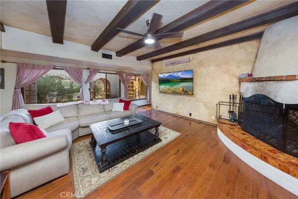 a large kitchen with stainless steel appliances granite countertop wooden cabinets a stove top oven a sink and dishwasher